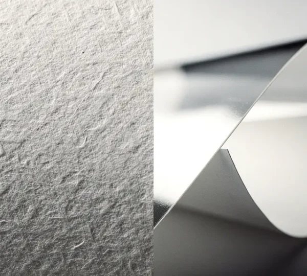 Comparative display of cotton rag and resin coated photo papers showing texture and finish differences