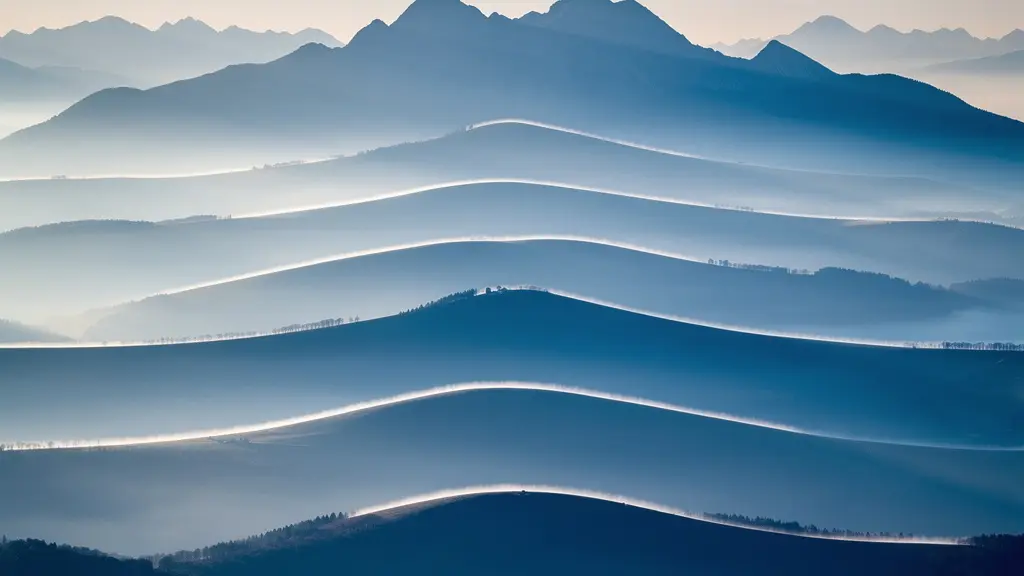 Abstract landscape showing compressed mountain layers creating graphic patterns