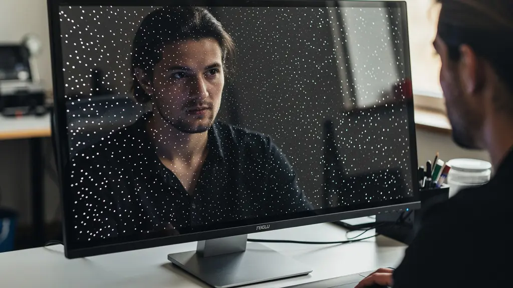 Close-up of photographer using spot visualization technique on monitor