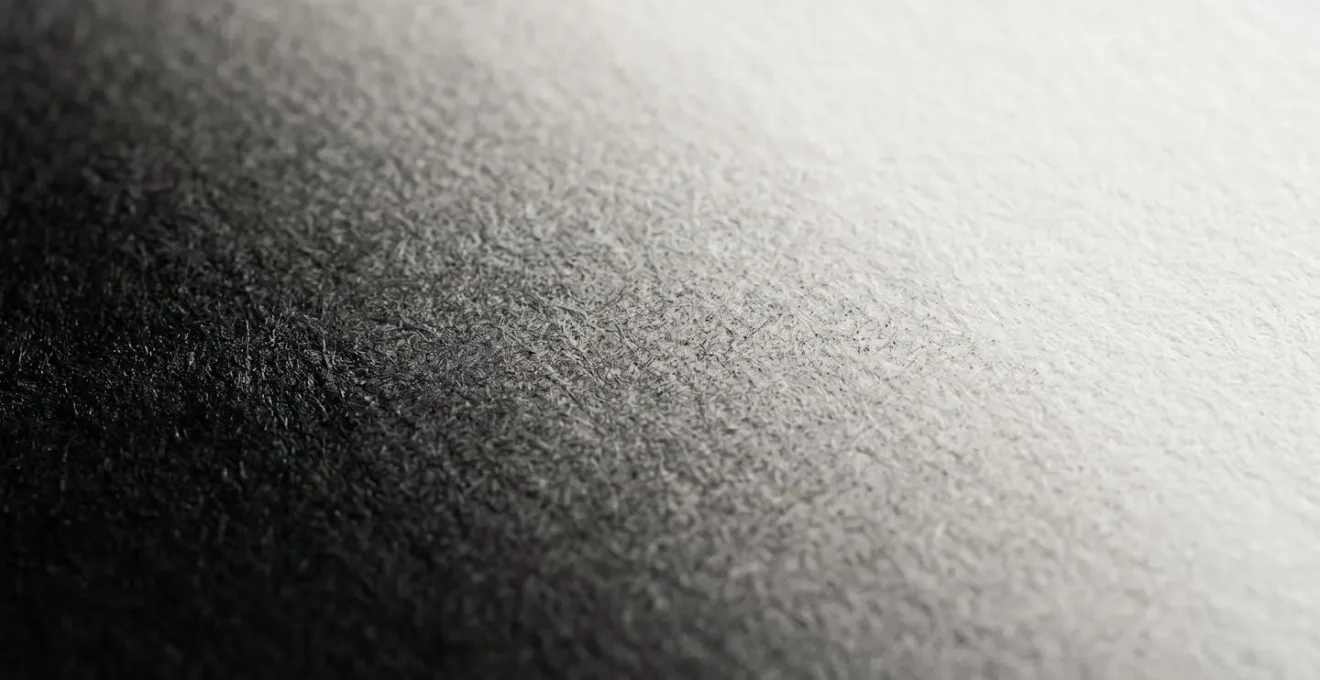Ultra-detailed macro view of a smooth black to white gradient showing flawless tonal transitions